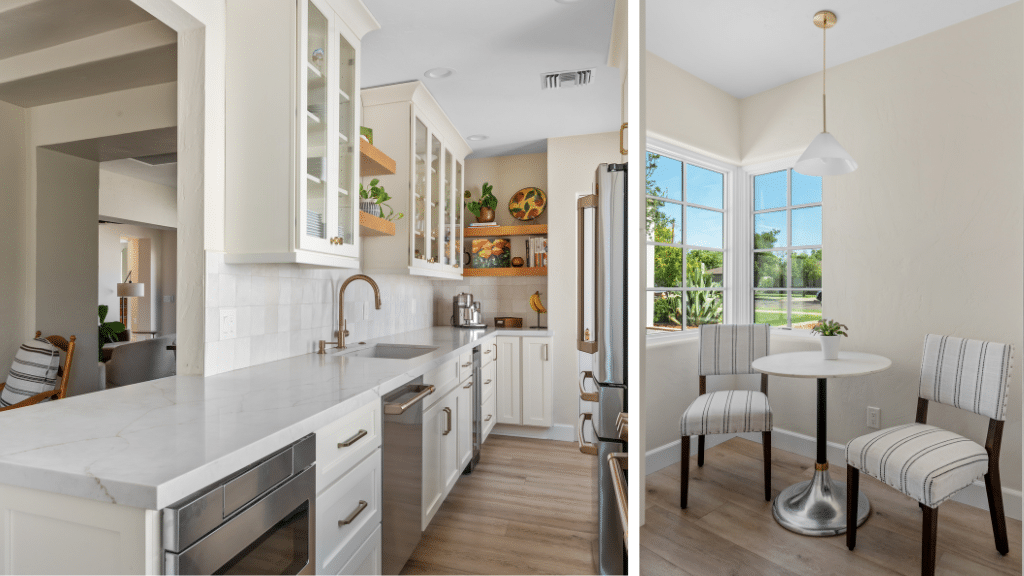 A modern white kitchen in a Phoenix historic home renovation, featuring marble countertops, glass-front cabinets, stainless steel appliances, and a cozy dining nook with a round table and two striped chairs beside large sunny windows.