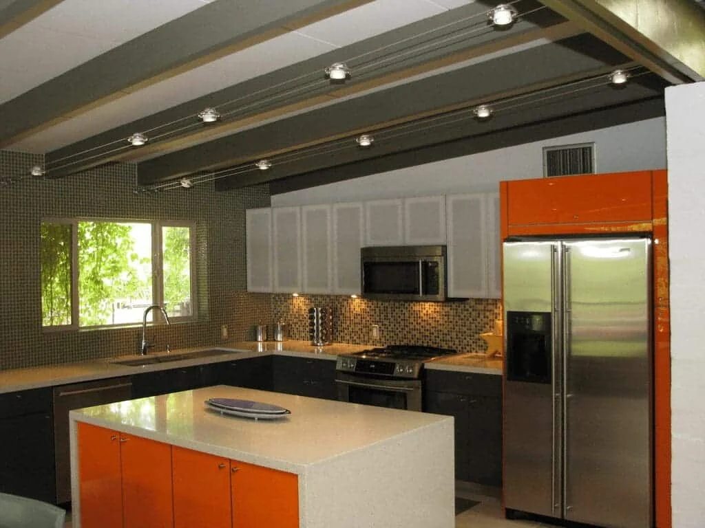 Mid-century modern kitchen remodel in a Ralph Haver home in Marlen Grove, Phoenix, with an orange island and exposed beams