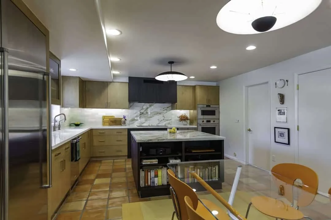 Completed Mesa kitchen renovation with a dark island, natural wood cabinetry, updated appliances, and a coordinated cooking wall