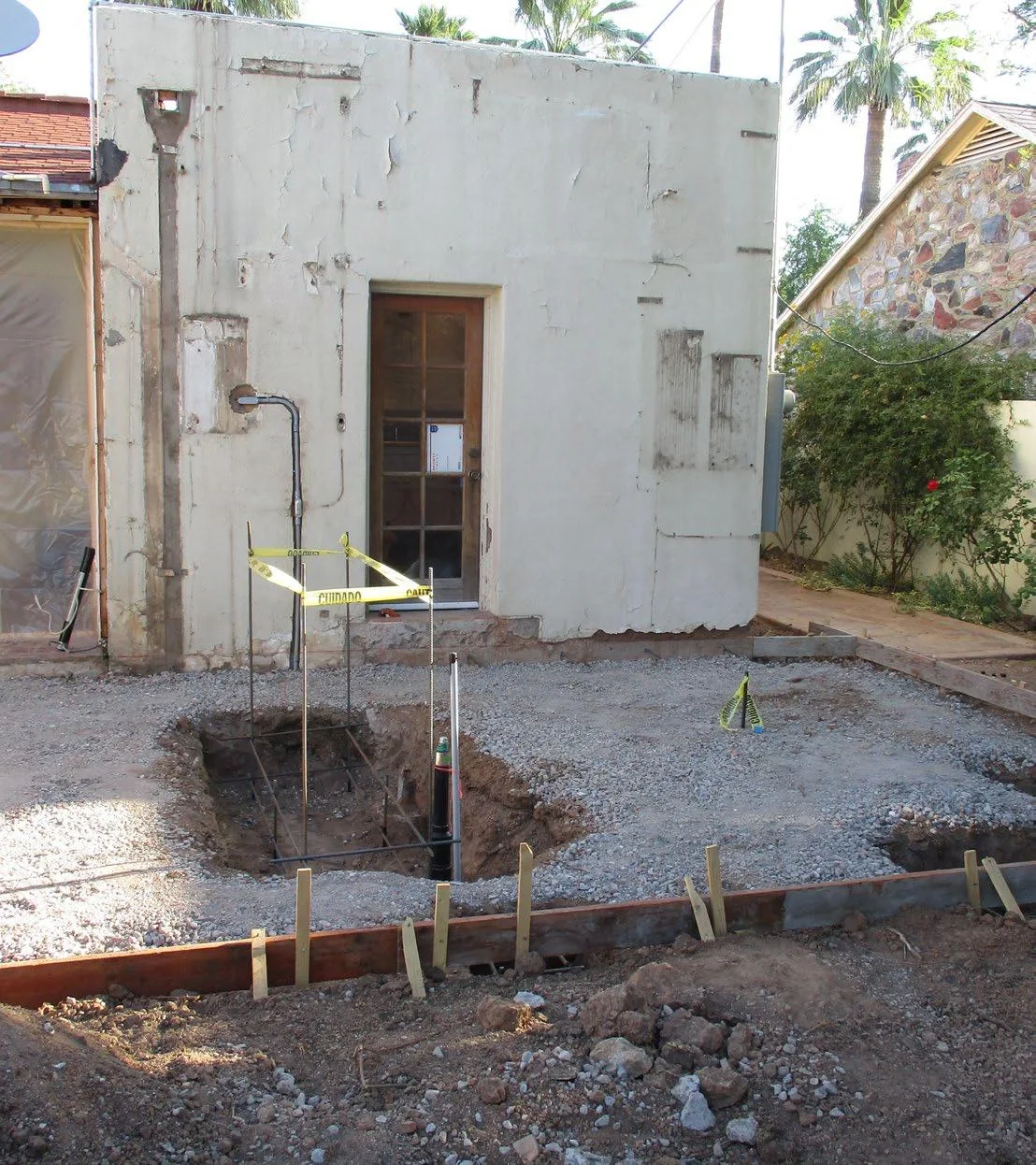 New patio slab forms and reinforcing steel for the fireplace and barbecue foundations