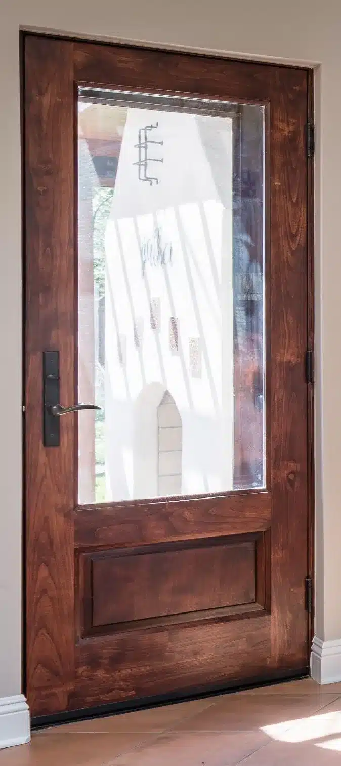 Custom wood back entry door fitted to the historic adobe kitchen opening